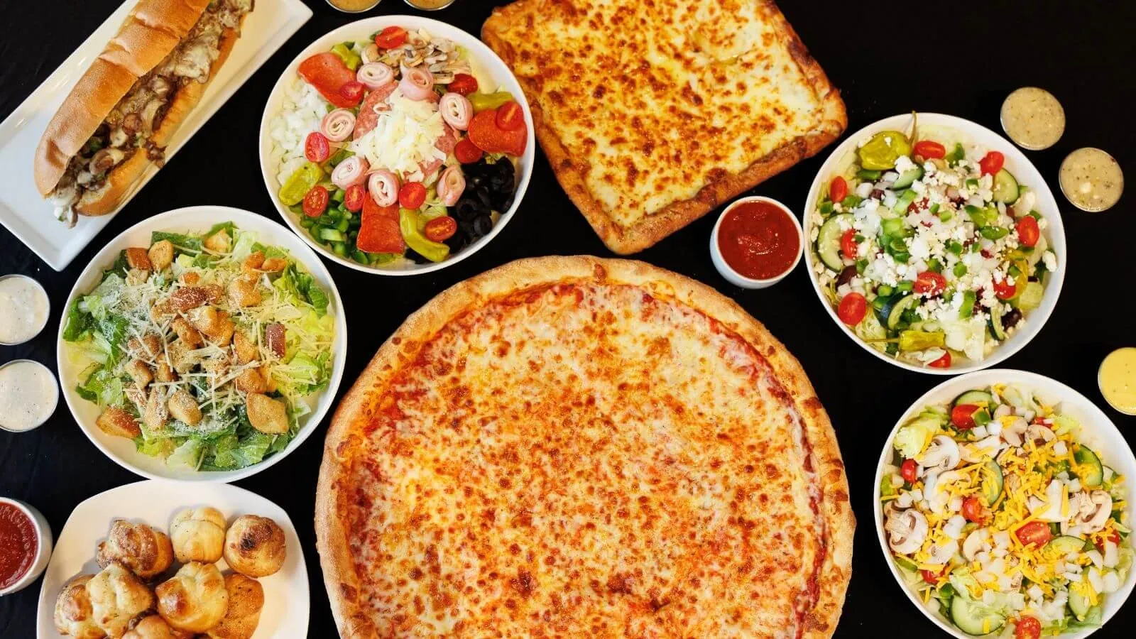 Pizza, salad and appetizers from Slice of The Burg